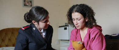 Young woman and Salvationist talking