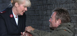 Homeless man speaking to a Salvation Army officer
