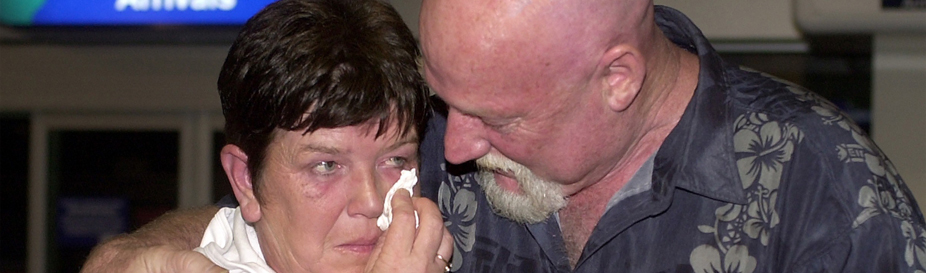 Two people meeting at an airport