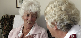 Older person speaking to a Salvation Army officer
