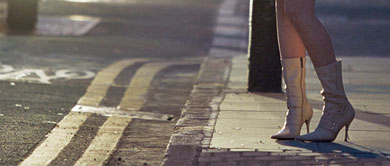 Woman standing on street corner