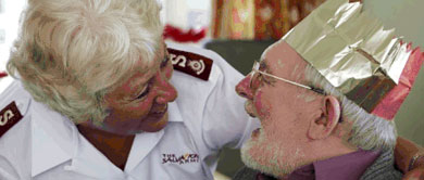 Older man and Salvation Army officer talking