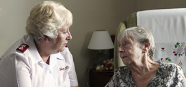 Older person speaking to a Salvation Army officer