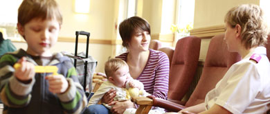Young family playing and talking at The Salvation Army