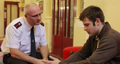 A Salvation Army Officer and a man talking