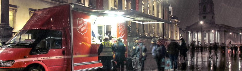 People queuing at a Salvation Army emergency vehicle