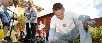 Group of Salvation Army young people digging a garden